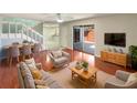 Inviting living room featuring a comfortable seating arrangement and a large sliding door at 1912 Cattleya Dr, Kissimmee, FL 34741