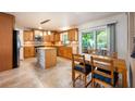 Modern kitchen featuring stainless steel appliances, tile backsplash, a center island and breakfast nook with sliding glass doors at 2020 Corner Glen Dr, Orlando, FL 32820