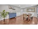 Dining room featuring hardwood floors and decorative wainscoting at 303 W Par St, Orlando, FL 32804