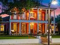 Beautiful two-story house with a large front porch and balcony offering a picturesque view and inviting ambiance at 4350 New Broad St, Orlando, FL 32814