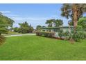 Lush green lawn and landscaping complement this inviting single-story home at 4436 Larado Pl, Orlando, FL 32812