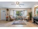 Bright living room with neutral walls, large windows, and cozy seating arrangement at 611 Green Briar Blvd, Altamonte Springs, FL 32714