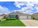 Beautiful single-Gathering home with a well-kept lawn and a three-car garage, perfect for a growing Gathering at 6960 Audobon Osprey Cv, Harmony, FL 34773