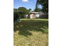 Spacious backyard with a small storage shed, perfect for outdoor activities and entertaining at 710 W Swoope W Ave, Winter Park, FL 32789