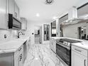 Bright modern kitchen with stainless appliances, custom cabinets, and an open design at 3407 Silverwood Dr, Orlando, FL 32808