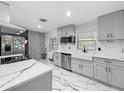 Well-lit kitchen with sleek countertops, stainless steel appliances, and stylish cabinetry at 3407 Silverwood Dr, Orlando, FL 32808