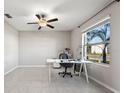 Spacious office space with ample natural light, featuring tile flooring and a ceiling fan at 5553 Turkey Creek Way, Lakeland, FL 33811