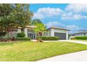 Charming single-Gathering home with lush landscaping and a well-manicured lawn at 8023 Canyon Lake Cir, Orlando, FL 32835