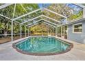 Inviting screened-in pool area, perfect for relaxation and outdoor enjoyment at 1111 Lynx Trl, Winter Springs, FL 32708