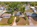 Aerial view of the property showing the house, yard with green borders, and neighborhood at 1219 Helen St, Apopka, FL 32703