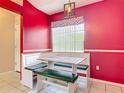 Eat-in kitchen with custom breakfast nook and modern lighting at 1606 Bismarck Dr, Deltona, FL 32725