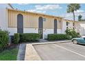 Condo exterior with parking, updated facade, manicured hedges, and convenient unit numbers at 200 Maitland Ave # 52, Altamonte Springs, FL 32701