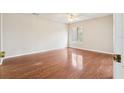 Bedroom with wood floors and a bright window at 2309 Sun Valley Cir # 2309, Winter Park, FL 32792