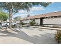 Exterior shot of the home with well-maintained landscaping and a dedicated parking space at 2309 Sun Valley Cir # 2309, Winter Park, FL 32792