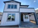 Modern two-story home with gray trim, large windows, and covered front porch, ready for personalization at 2980 Embark Trail, St Cloud, FL 34771