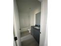 Clean bathroom featuring a toilet, vanity with dark countertops, and shower at 3432 Tranquil Trl, Kissimmee, FL 34747