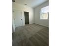 Bright bedroom with closet, carpeted floors, and large window offering natural light at 3432 Tranquil Trl, Kissimmee, FL 34747