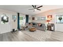 Bright living room features a large window, comfortable seating, and stylish decor at 3631 Surrey Dr, Orlando, FL 32812