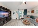 Bright living room features a large window, comfortable seating, and stylish decor at 3631 Surrey Dr, Orlando, FL 32812