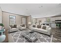 Bright living room with modern decor and plenty of natural light, perfect for entertaining at 4425 Mobilaire Dr, Orlando, FL 32822