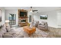 Inviting living room features a brick fireplace, plush seating, and a cozy rug at 5212 Waterwood Run, Bartow, FL 33830
