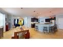 Open-concept kitchen and dining area featuring modern appliances, stylish cabinetry, and ample counter space at 6152 Meriwether, Winter Garden, FL 34787