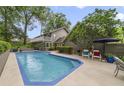 Inviting backyard pool with patio seating and lush landscaping, perfect for outdoor relaxation and entertaining at 981 Victoria Ter, Altamonte Springs, FL 32701