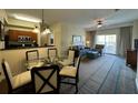 Open-concept living and dining area with plenty of natural light at 8125 Resort Village Dr # 51006, Orlando, FL 32821