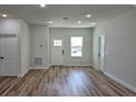 Inviting living room with neutral walls and modern wood-look flooring at 16670 Sw 29Th Terrace Rd, Ocala, FL 34473