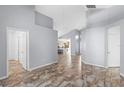 Spacious living room featuring tile floors, neutral walls, and an open floor plan perfect for comfortable living and entertaining guests at 9301 Echo Run, Orlando, FL 32817