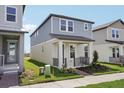 Attractive two-story home with a covered entry and fresh landscaping at 16484 Silver Brook Way, Winter Garden, FL 34787