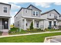 Stylish two-story home offers a contemporary design, well-manicured lawn, and inviting entrance at 5127 Passion Flower Way, Winter Garden, FL 34787