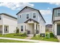 Charming two-story home with blue siding, stone accents, and a well-maintained front yard at 5235 Passion Flower Way, Winter Garden, FL 34787