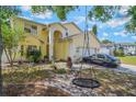 Charming two-story home featuring a well-manicured lawn and attached two-car garage at 1188 Foxforrest Cir, Apopka, FL 32712
