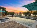 Enjoy the backyard pool, great views, and perfect sunsets in this spectacular outdoor living space at 12635 Amber Ave, Clermont, FL 34711
