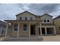 Charming two-story home featuring a welcoming covered porch and attached two-car garage at 22117 Amberbush Court, Mount Dora, FL 32757