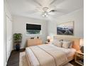 Bright bedroom featuring a ceiling fan, large window, neutral decor, and wood-look flooring at 224 Briar Cliff Dr, Longwood, FL 32779