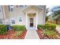 Charming townhome entrance featuring neat landscaping and a welcoming walkway at 3238 Wish Ave, Kissimmee, FL 34747