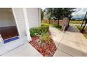 Paved walkway leading to a gated community with lush landscaping at 3238 Wish Ave, Kissimmee, FL 34747