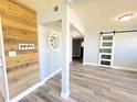 Bright living room showcasing the accent wall and barn door for a modern touch at 511 S Alder Ave, Orlando, FL 32807