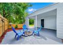 Relaxing outdoor patio with seating around a fire pit, perfect for entertaining and enjoying the fresh air at 511 S Alder Ave, Orlando, FL 32807