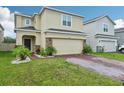 Charming two-story home with brick paver driveway and well manicured front yard at 5248 Royal Point Ave, Kissimmee, FL 34746