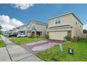 Street view of charming two-story homes with well-manicured lawns and paver driveways at 5248 Royal Point Ave, Kissimmee, FL 34746