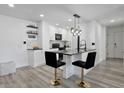 Chic, updated kitchen featuring modern countertops, sleek fixtures and stylish bar stool seating at 6142 Westgate Dr # 204, Orlando, FL 32835
