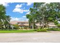 Beautiful home with a well-kept lawn, lush landscaping, and a welcoming entrance at 645 Manor Rd, Maitland, FL 32751