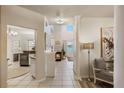 Bright and airy living space with views of the lake, fireplace, and decorative columns at 7420 Cypress Grove Rd # 132, Orlando, FL 32819