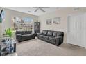 Cozy living room featuring two couches and neutral carpet at 8213 Claire Ann Dr # 108, Orlando, FL 32825