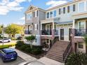 Inviting townhome exterior showcasing brick accents, front balconies, and well-maintained landscaping at 861 Taramundi Dr, Oviedo, FL 32765