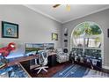 Inviting home office with a large window, custom built-ins, and a modern, sleek design at 9126 Shadowbrook Trl, Orlando, FL 32825