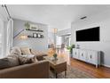 Cozy living room showcasing hardwood floors and modern decor at 715 Braidwood Ln, Orlando, FL 32803